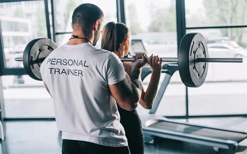 Woman consulting with a personal fitness trainer